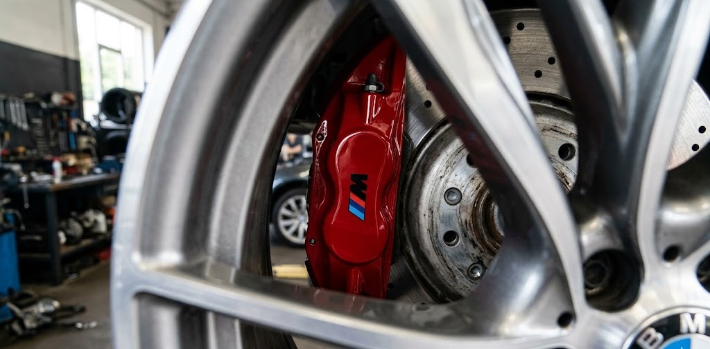 Freshly resprayed gloss red brake caliper