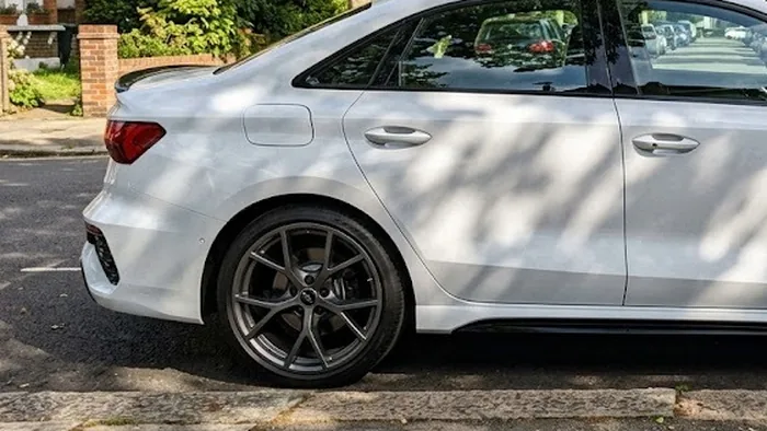 Priya T's Audi RS3 with anthracite powder coated alloys on a tree lined Ealing street