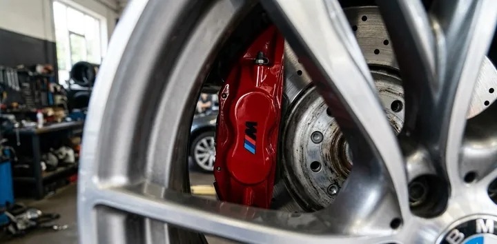 Freshly resprayed gloss red brake caliper